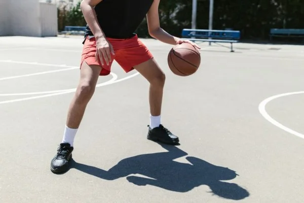 young basketball player dribbling